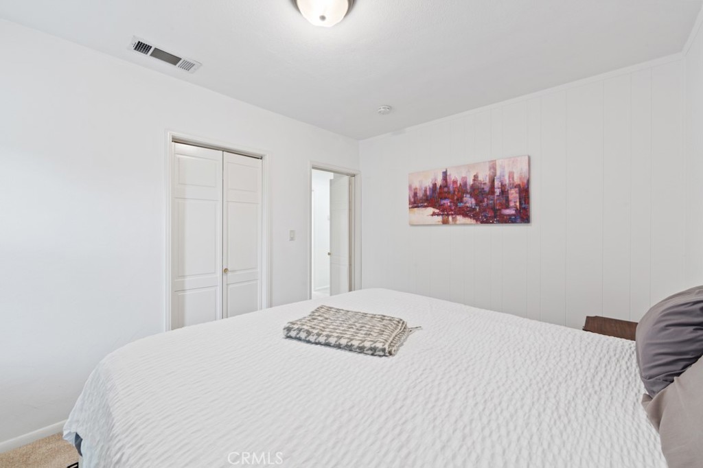 4425 Walnut Avenue Long Beach, CA 90807 - Photo 9 of 50 a bedroom with a bed and a painting on the wall