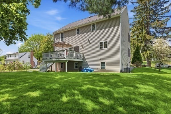 3 Wing Road Wilmington, MA 01887 - Photo 31 of 36 a white house that has a big yard with wooden fence