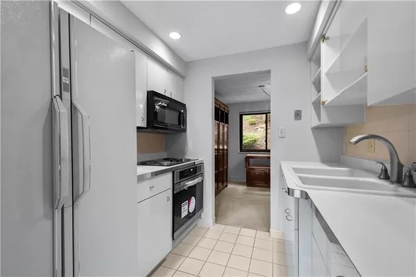 a kitchen with a stove and a microwave