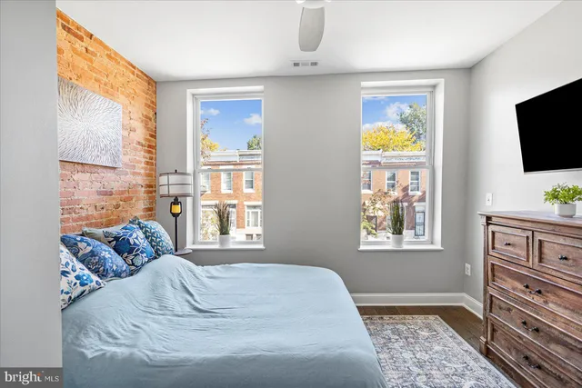 a bedroom with furniture and a window