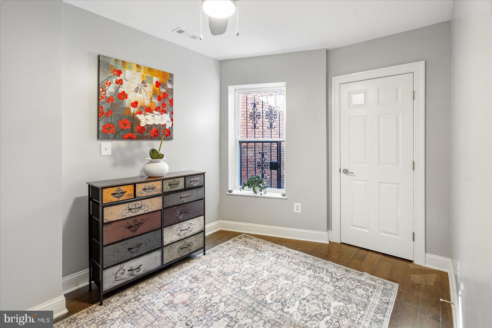 2428 McCulloh Street Baltimore, MD 21217 - Photo 23 of 42 wooden floor in an empty room with a window