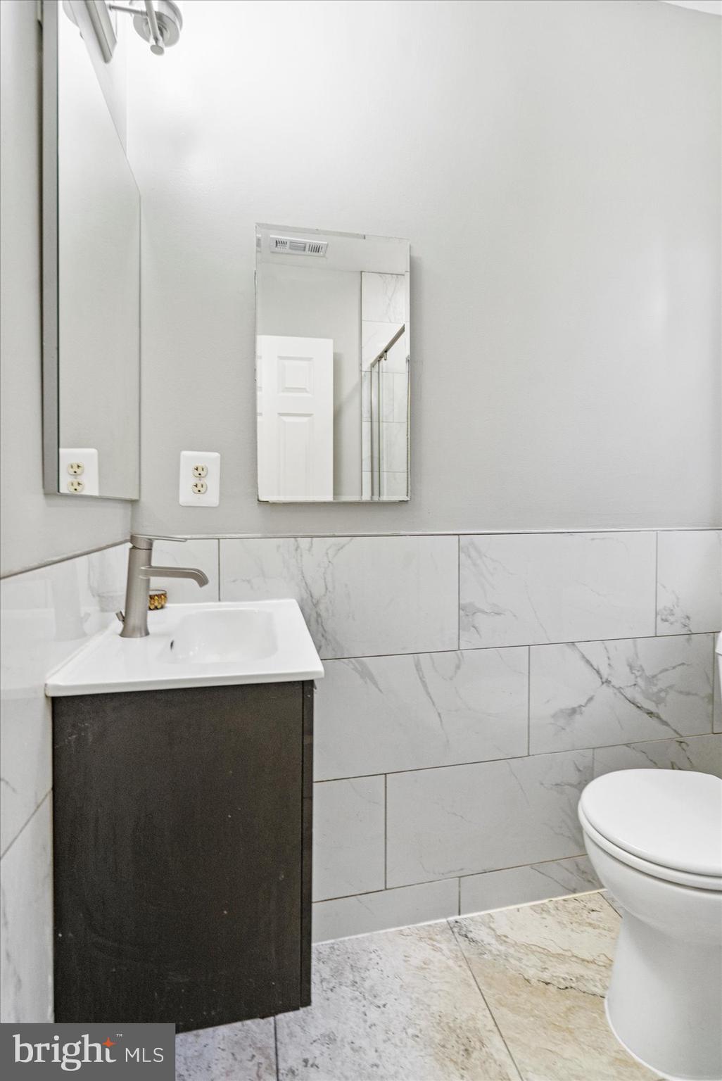 2428 McCulloh Street Baltimore, MD 21217 - Photo 28 of 42 a bathroom with a sink toilet and mirror