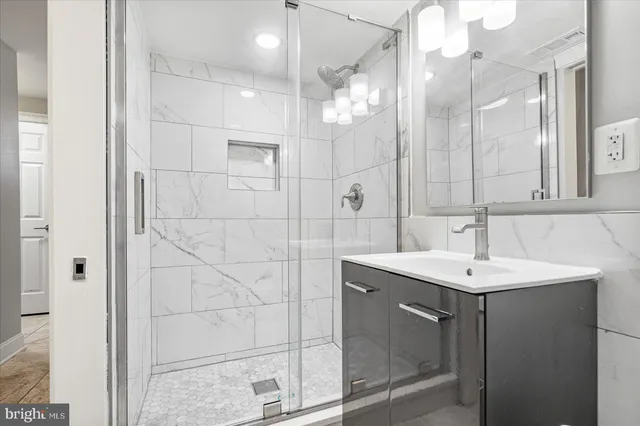 a bathroom with a sink and mirror