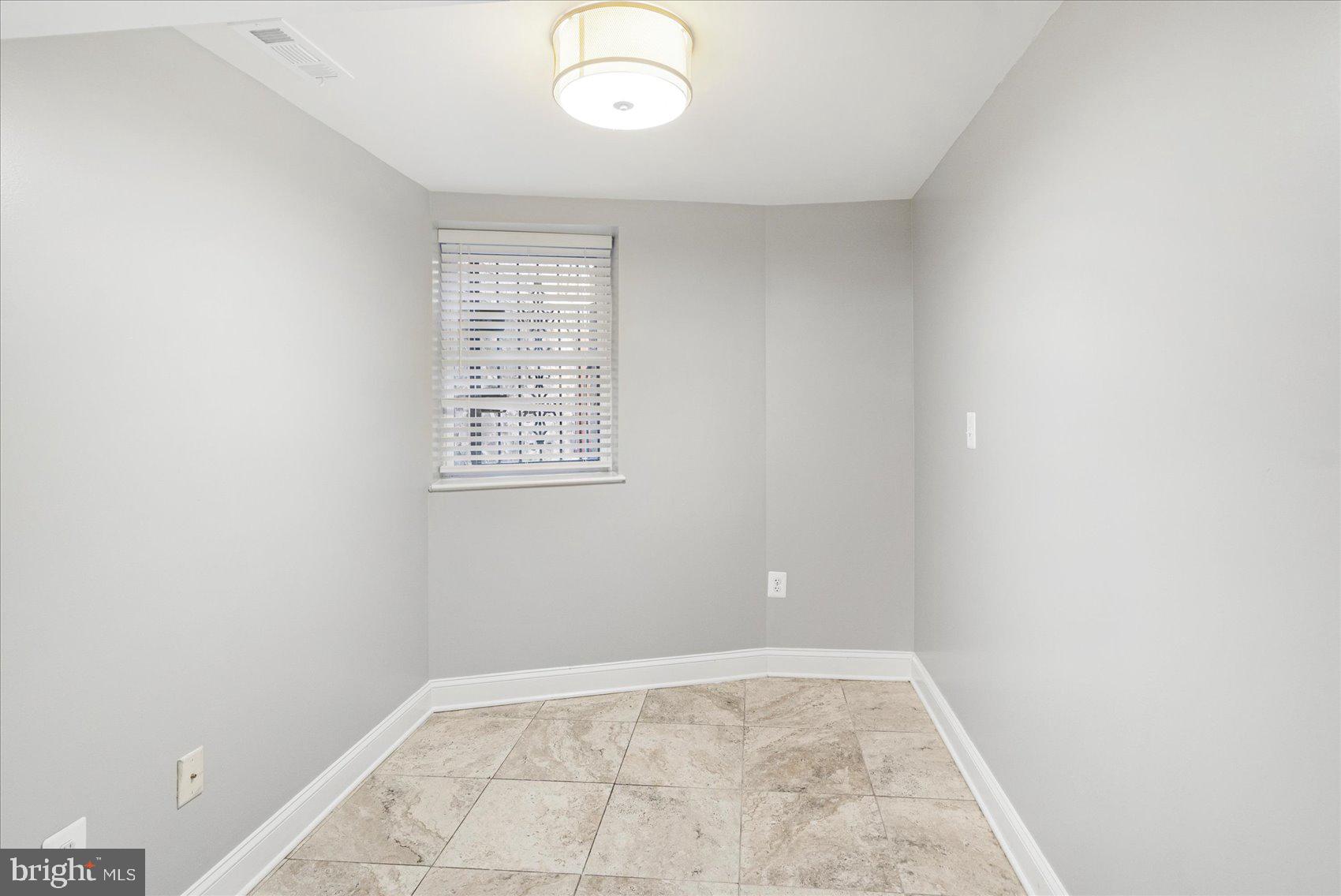 2428 McCulloh Street Baltimore, MD 21217 - Photo 33 of 42 an empty room with windows