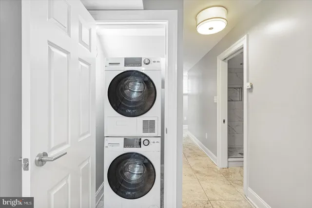 a view of a hallway with washer and dryer