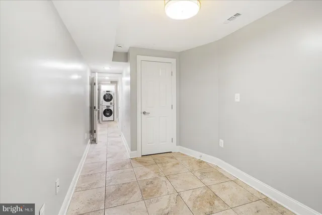 a view of a bathroom with a shower and a sink