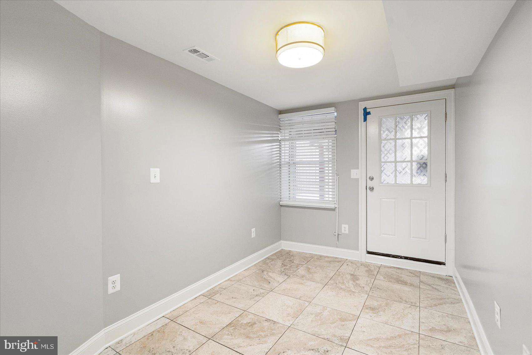 2428 McCulloh Street Baltimore, MD 21217 - Photo 37 of 42 an empty room with windows