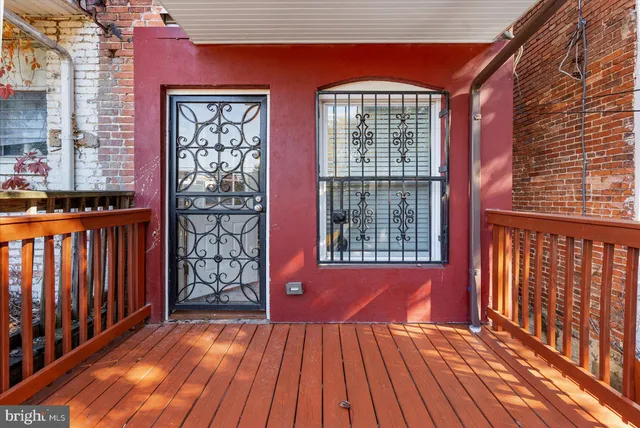 a view of front door with wooden floor
