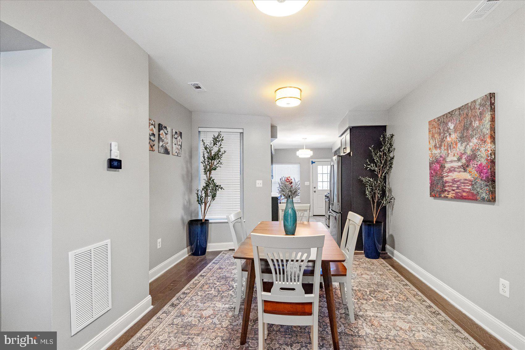 2428 McCulloh Street Baltimore, MD 21217 - Photo 7 of 42 a dining room with furniture and wooden floor