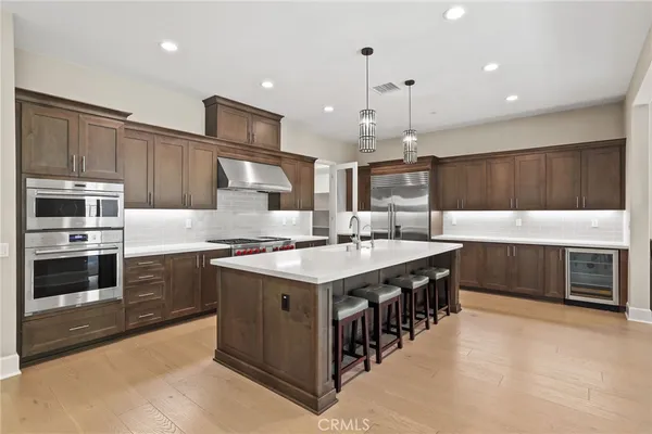 a kitchen with a stove sink and a microwave
