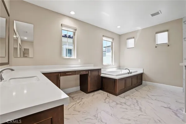 a kitchen with a stove sink and window