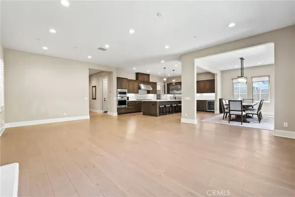 a view of kitchen with furniture and wooden floor
