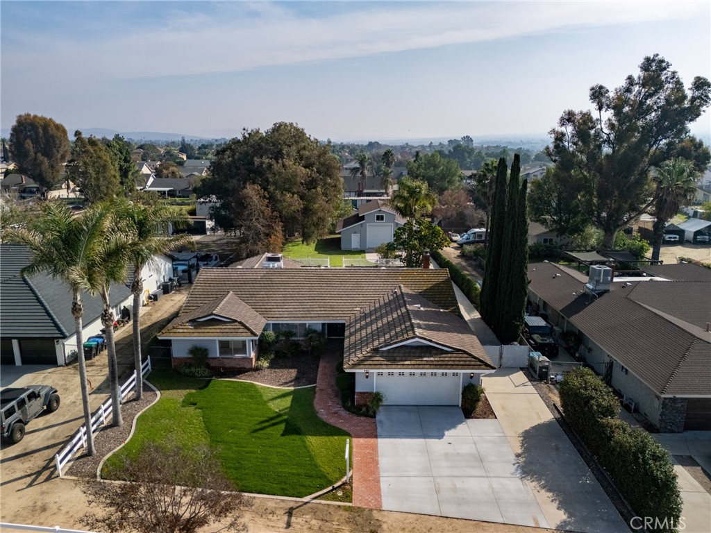 an aerial view of a house with a garden