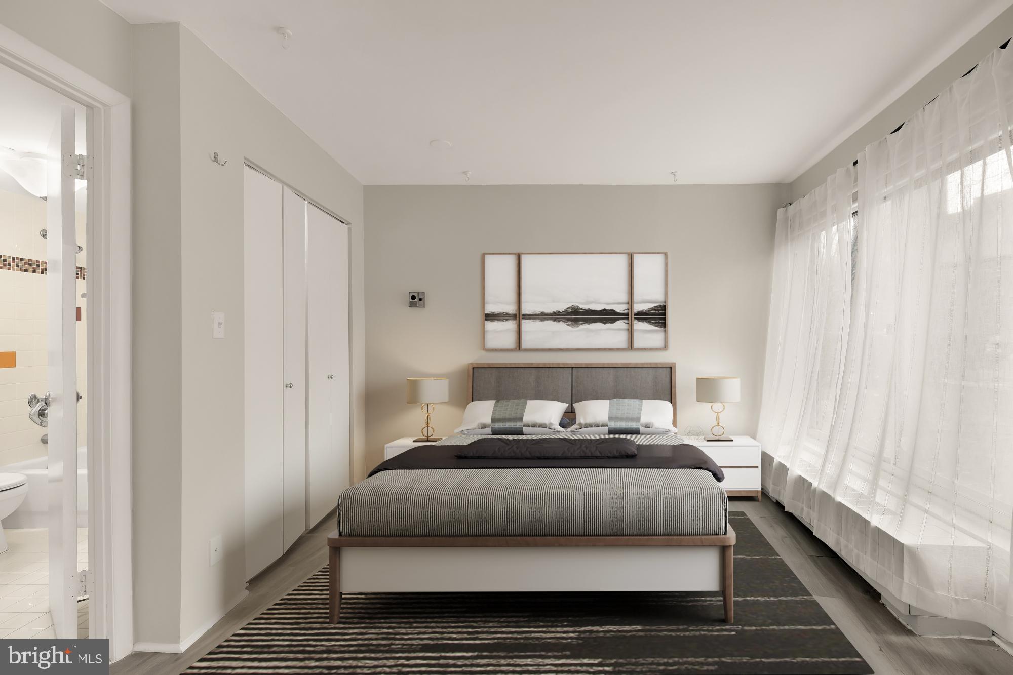 1239 Vermont Avenue Northwest, Unit 102 Washington, DC 20005 - Photo 12 of 21 a bedroom with a bed and a window