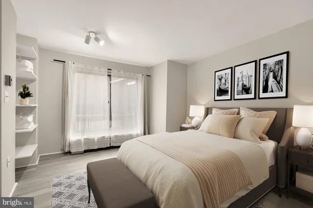 a spacious bedroom with a large bed and a couch