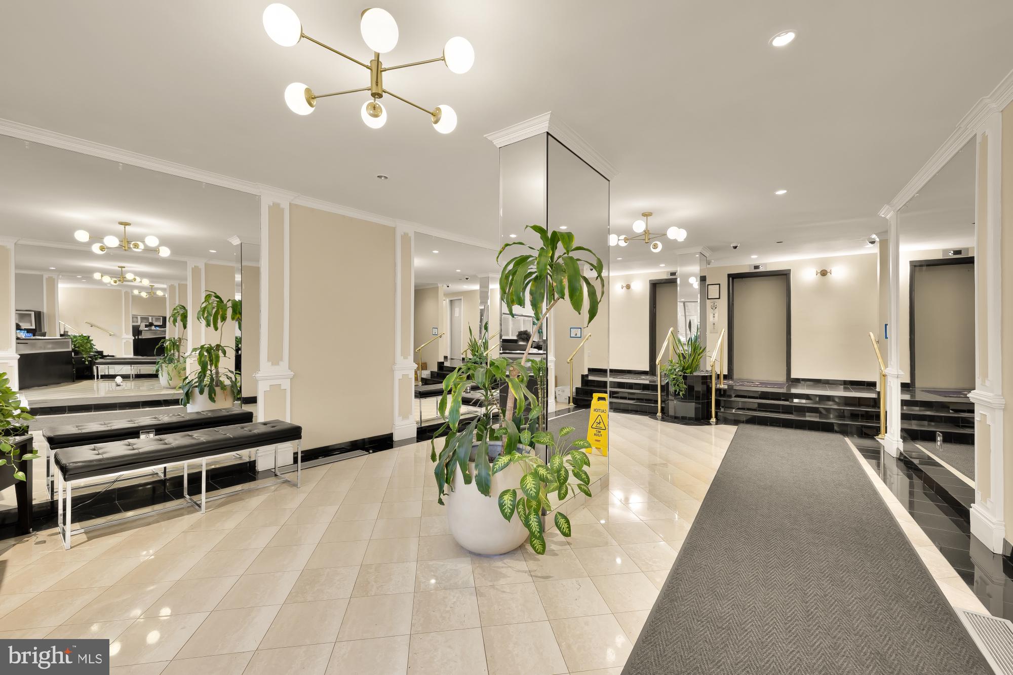 1239 Vermont Avenue Northwest, Unit 102 Washington, DC 20005 - Photo 3 of 21 a view of a lobby with furniture and a chandelier