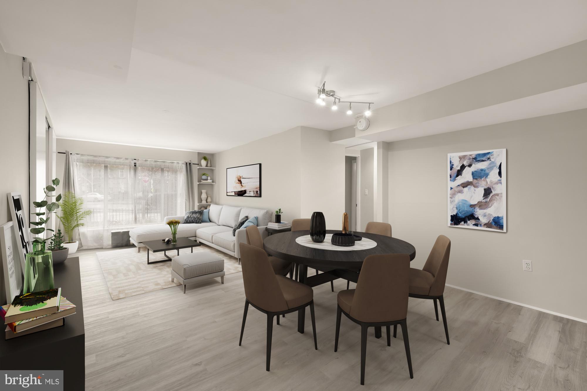 1239 Vermont Avenue Northwest, Unit 102 Washington, DC 20005 - Photo 4 of 21 a living room with furniture a table and a potted plant