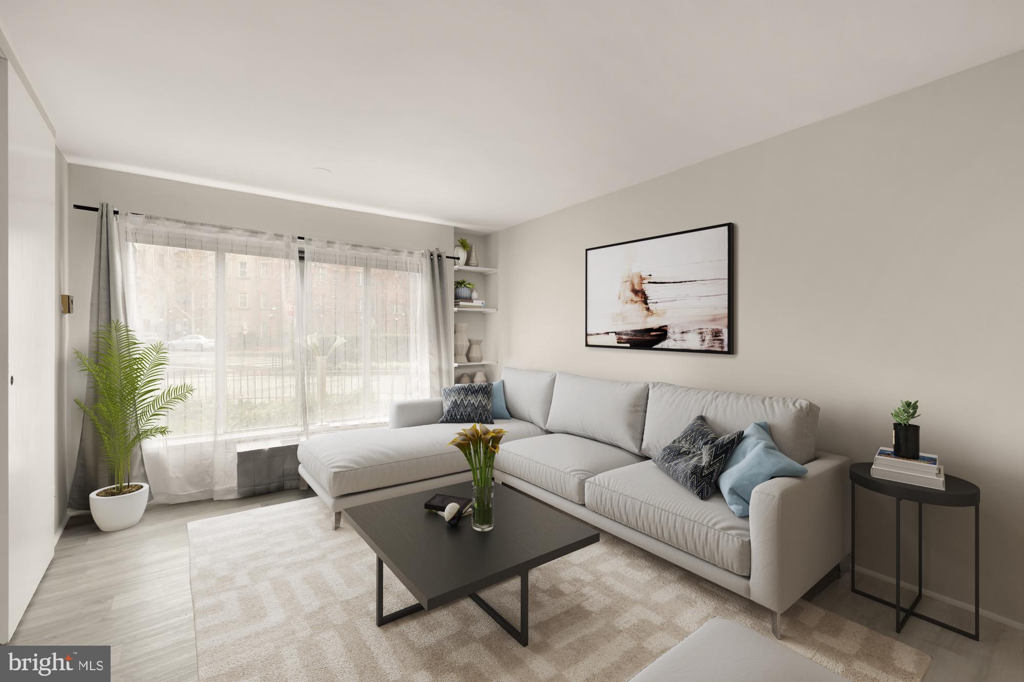 1239 Vermont Avenue Northwest, Unit 102 Washington, DC 20005 - Photo 5 of 21 a living room with furniture and a large window