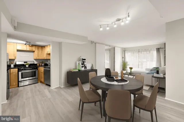 a kitchen with a dining table and chairs