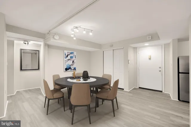a view of a dining room with furniture and wooden floor