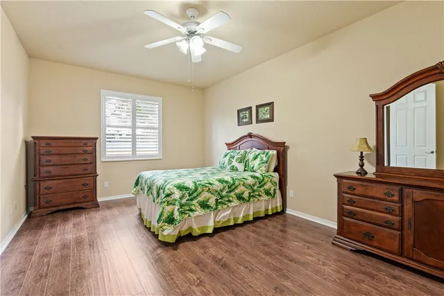 a living room with furniture and a dresser