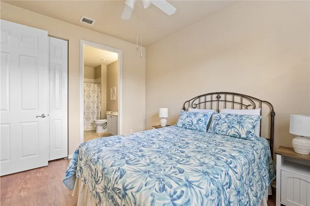 a bedroom with a bed and a mirror