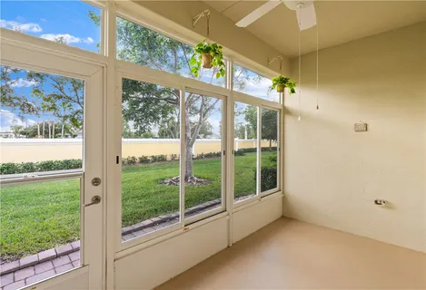 a view of an empty room with a large window