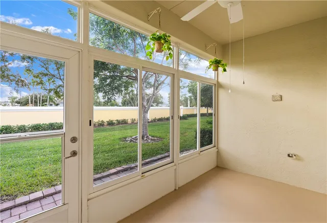 a view of an empty room with a large window