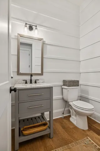 a living room with furniture kitchen view and a fireplace