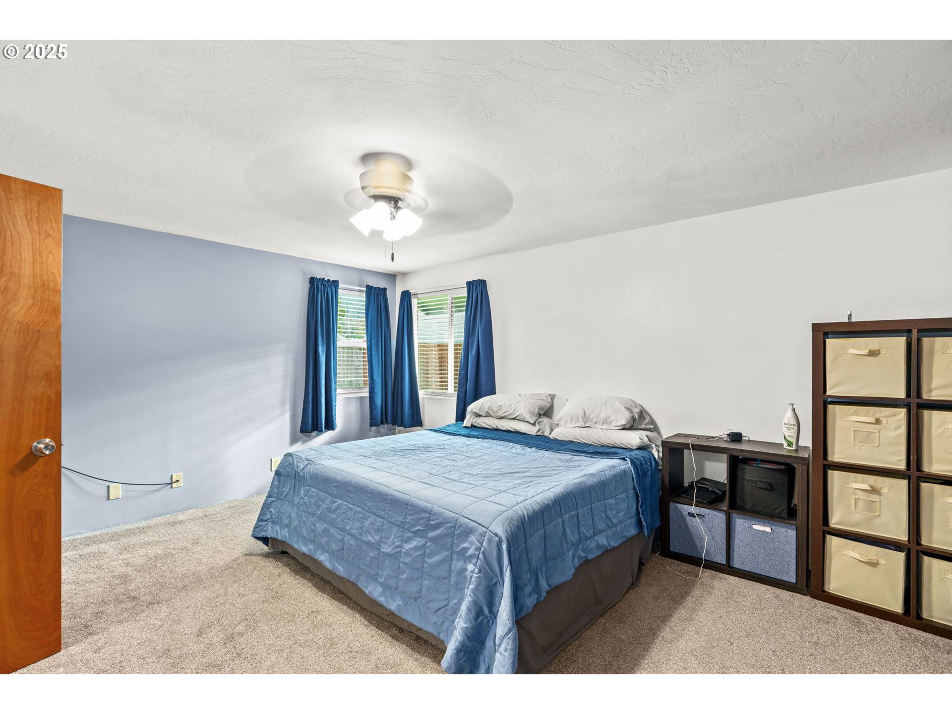 289 73rd Place Springfield, OR 97478 - Photo 22 of 32 a bedroom with a bed a dresser and potted plant