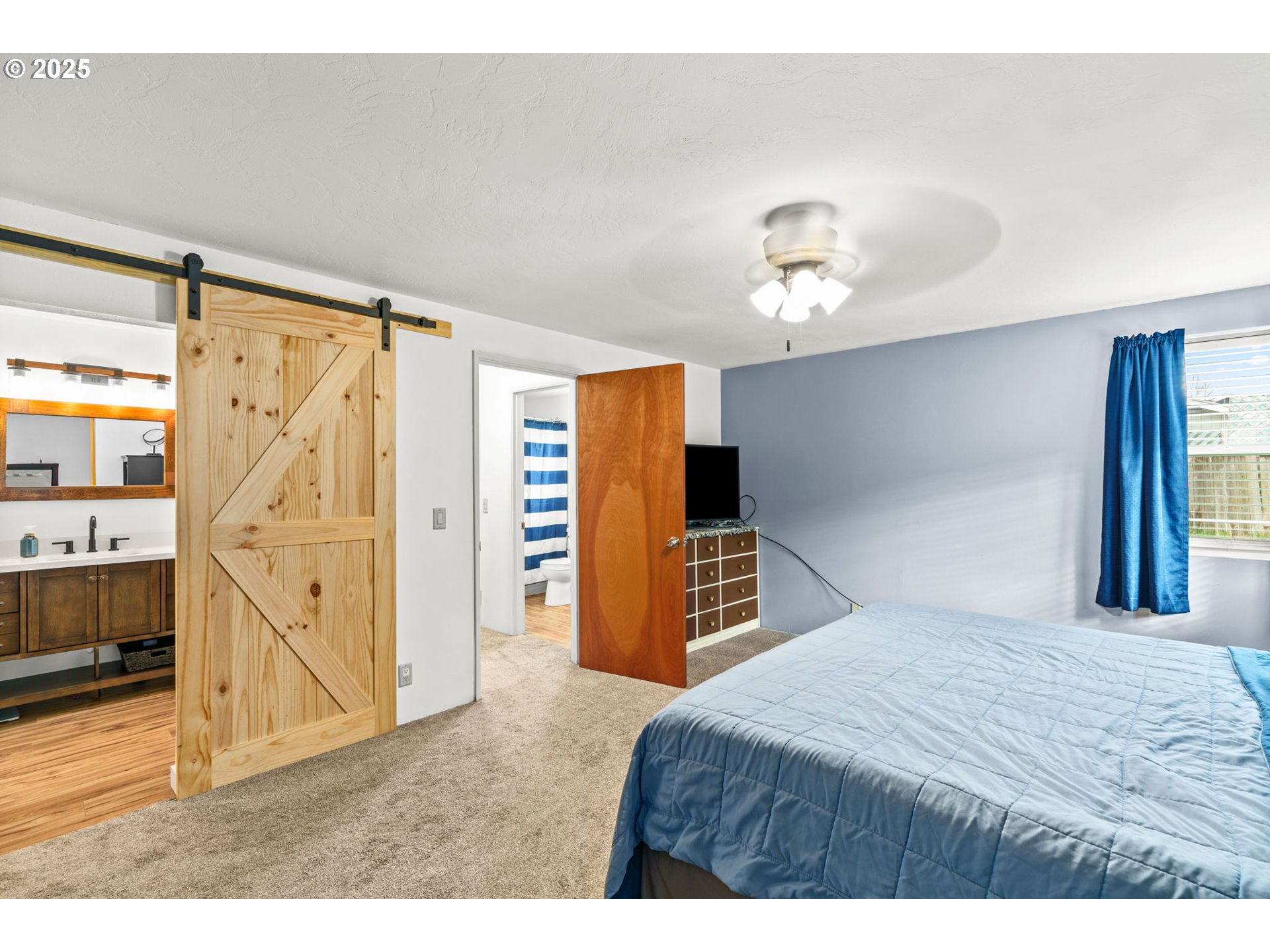 289 73rd Place Springfield, OR 97478 - Photo 24 of 32 a bedroom with a bed and a walk in closet