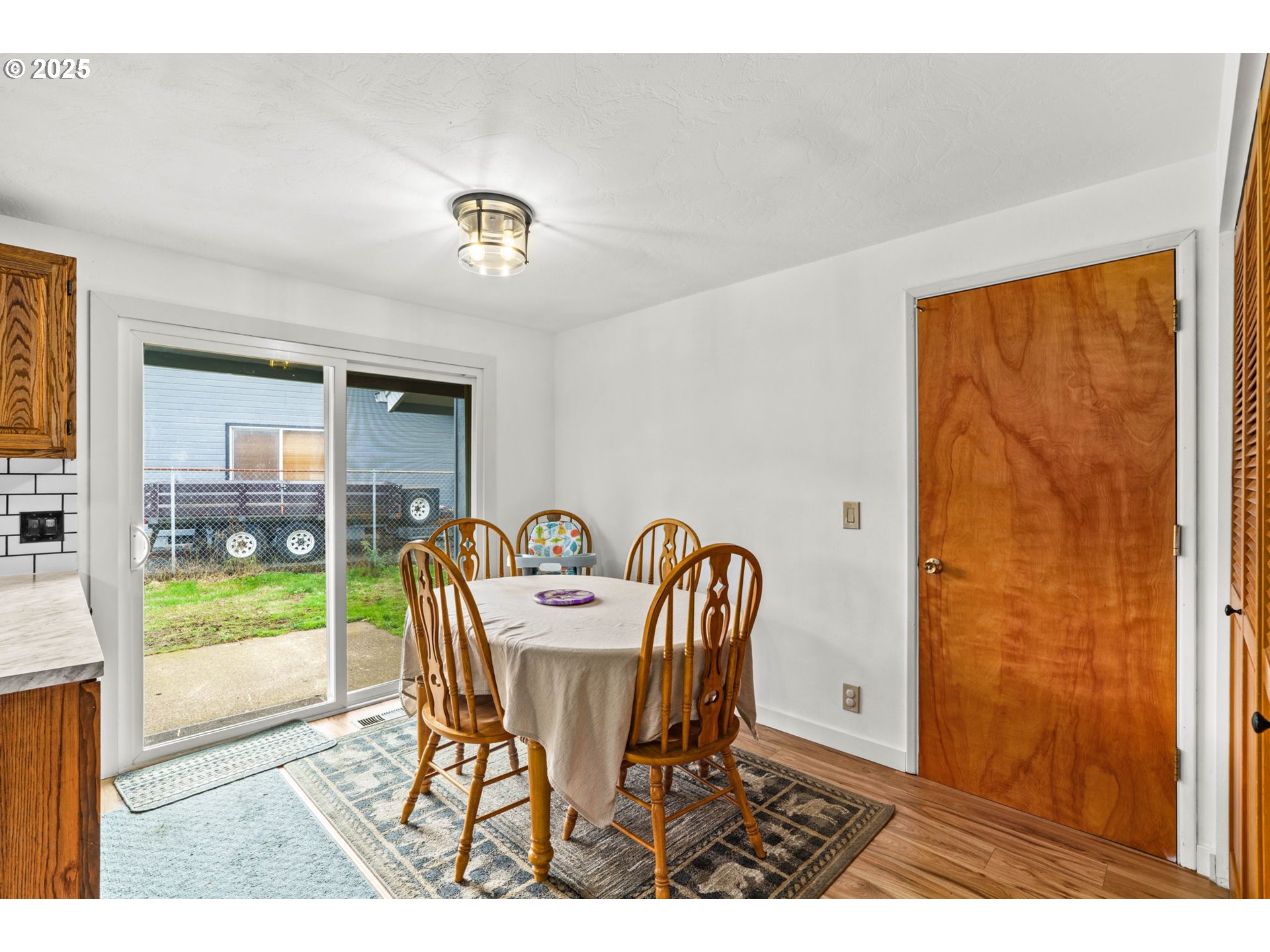 289 73rd Place Springfield, OR 97478 - Photo 9 of 32 a dining room with furniture and wooden floor