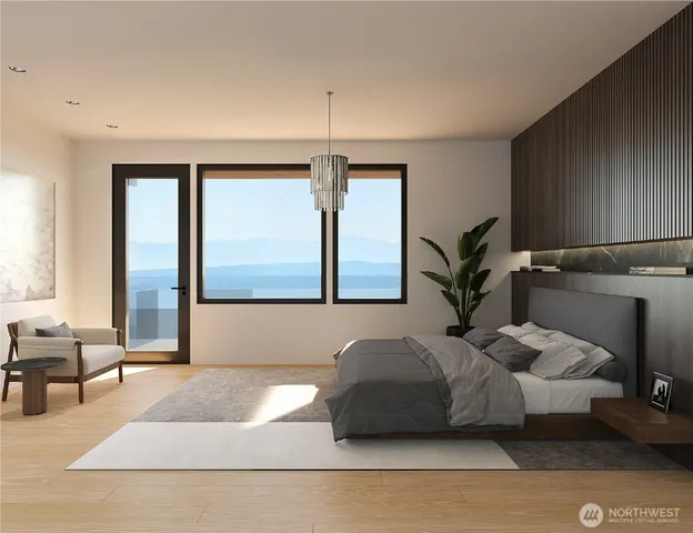 a bedroom with a bed and a large window