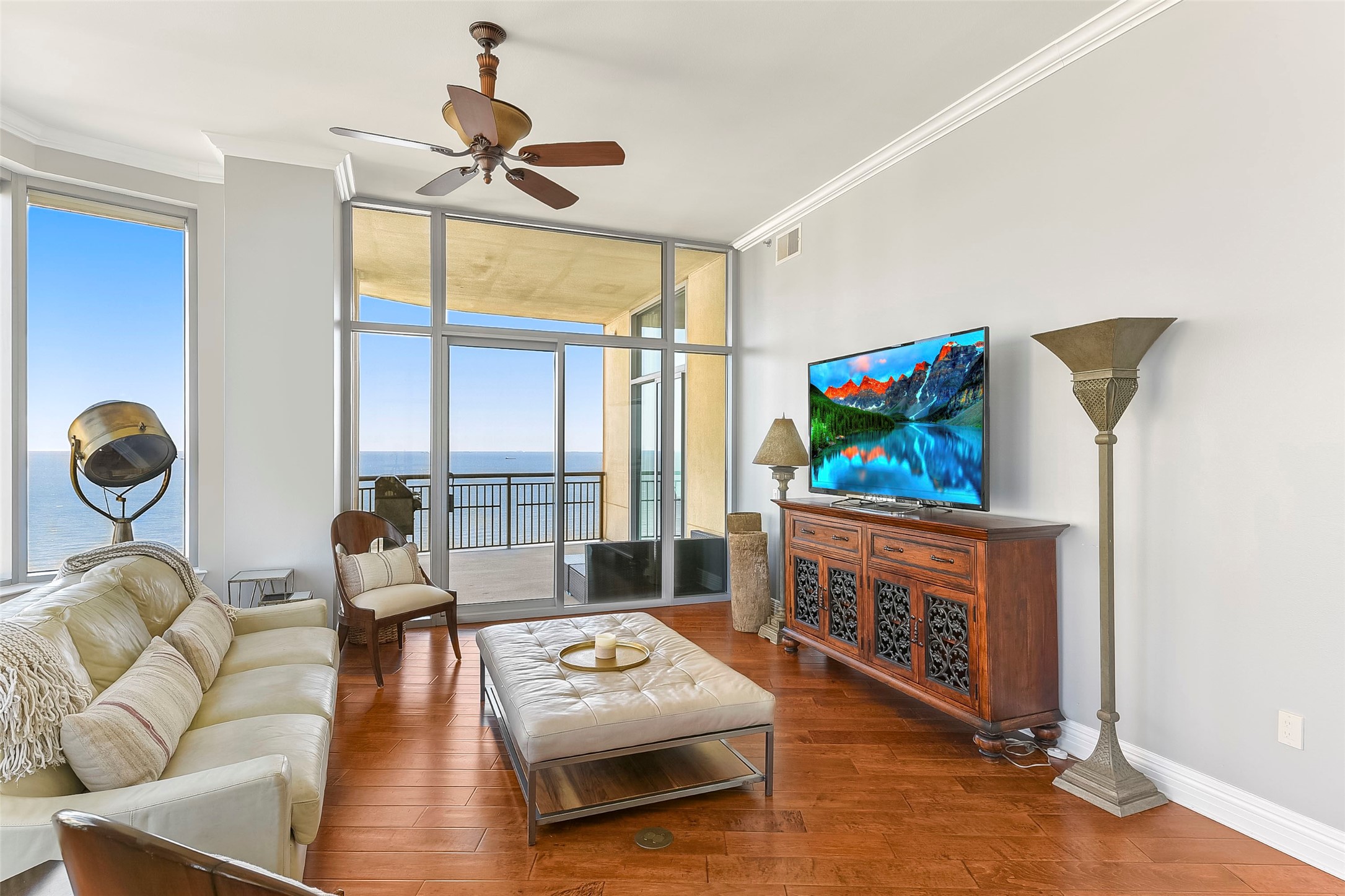 801 East Beach Drive, Unit TW2704 Galveston, TX 77550 - Photo 12 of 48 a living room with furniture and a flat screen tv