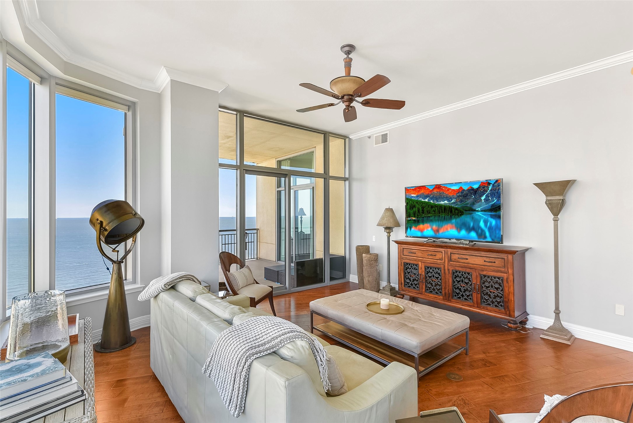 801 East Beach Drive, Unit TW2704 Galveston, TX 77550 - Photo 13 of 48 a living room with furniture a fireplace and a flat screen tv