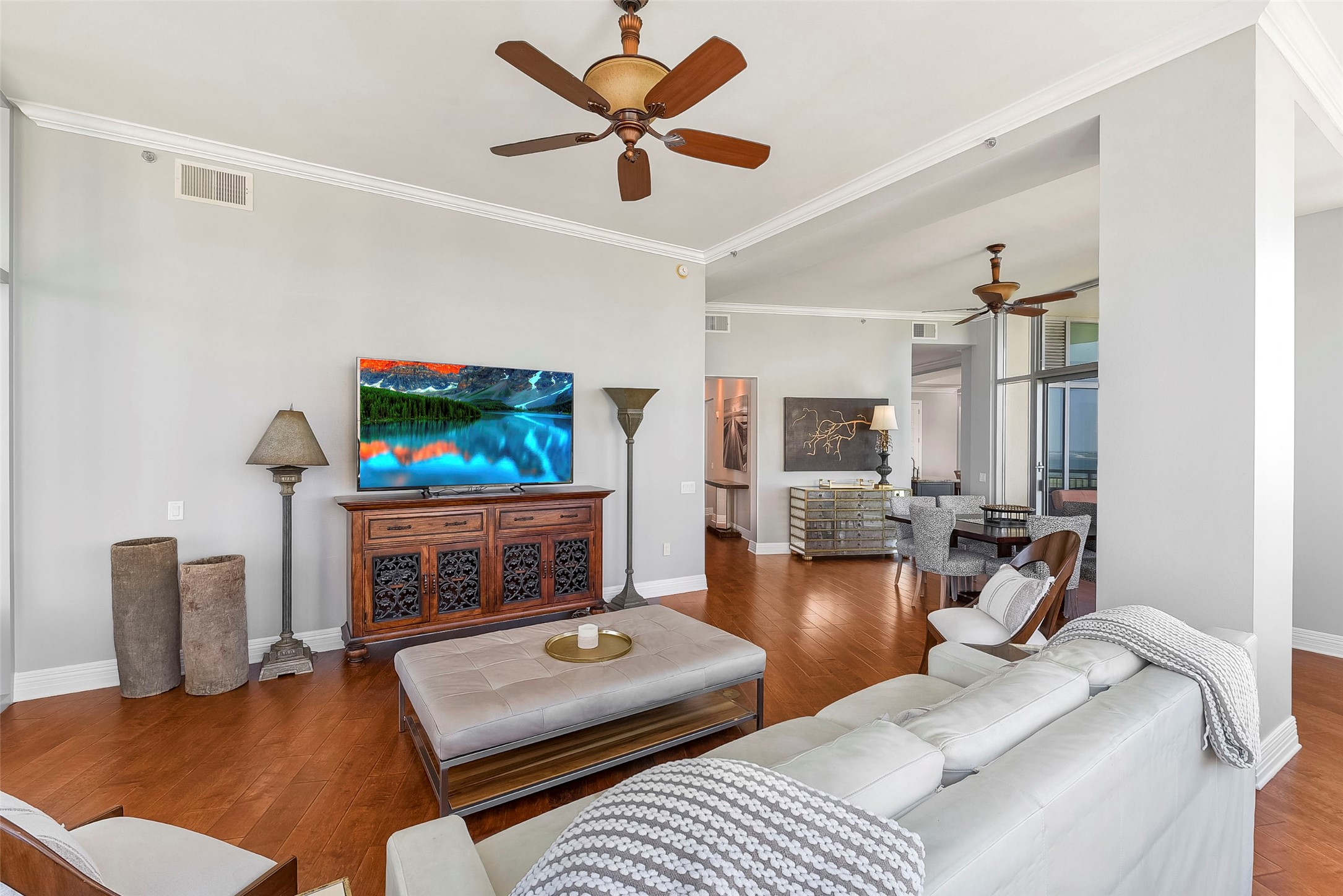 801 East Beach Drive, Unit TW2704 Galveston, TX 77550 - Photo 14 of 48 a living room with furniture a flat screen tv and a fireplace