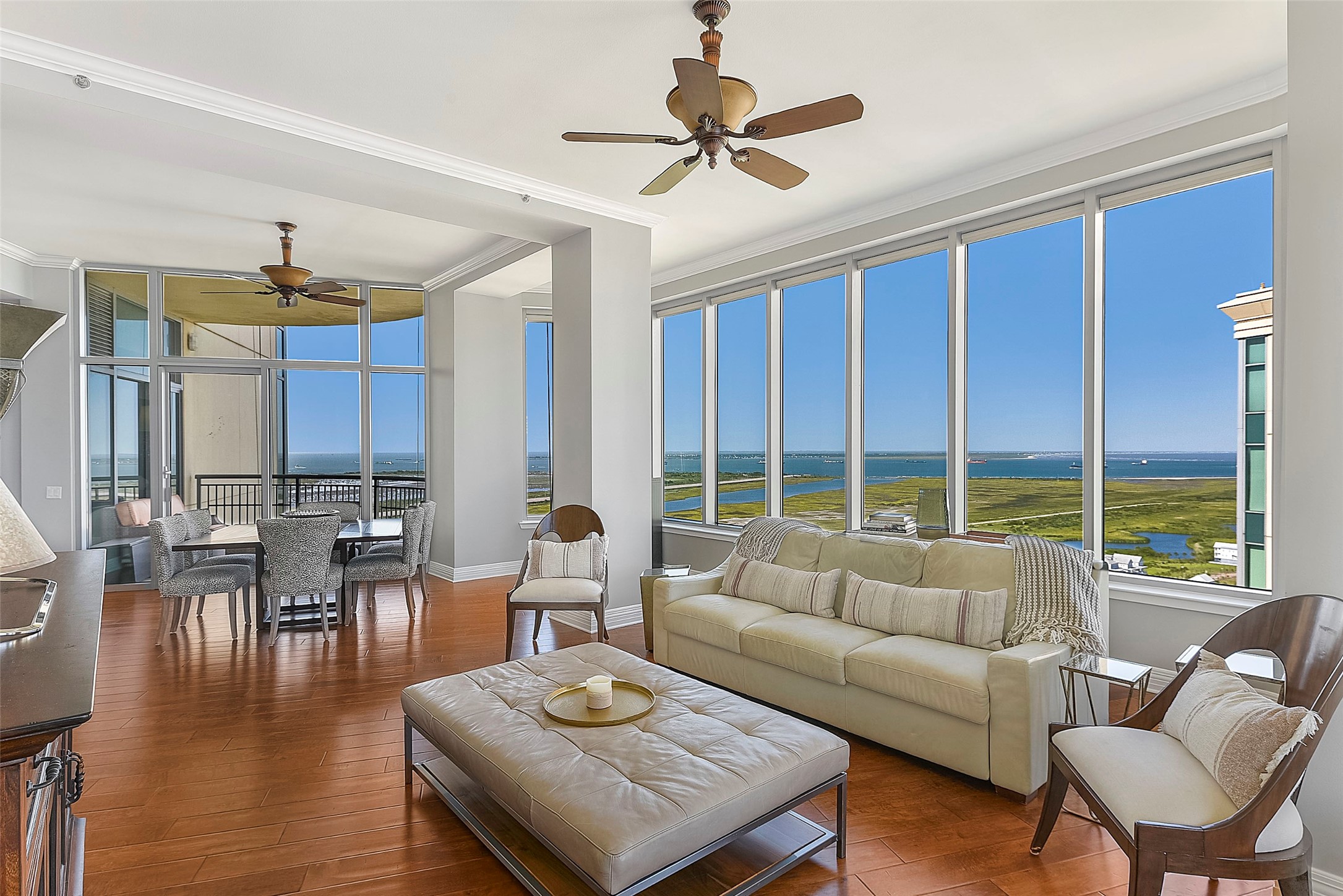 801 East Beach Drive, Unit TW2704 Galveston, TX 77550 - Photo 16 of 48 a living room with furniture and a large window