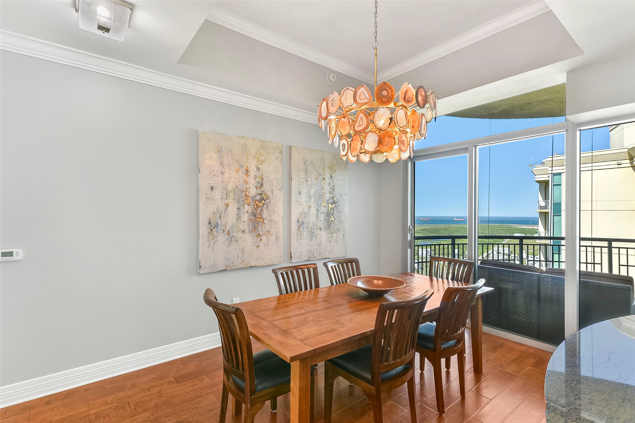 801 East Beach Drive, Unit TW2704 Galveston, TX 77550 - Photo 22 of 48 a view of a dining room with furniture window and outside view