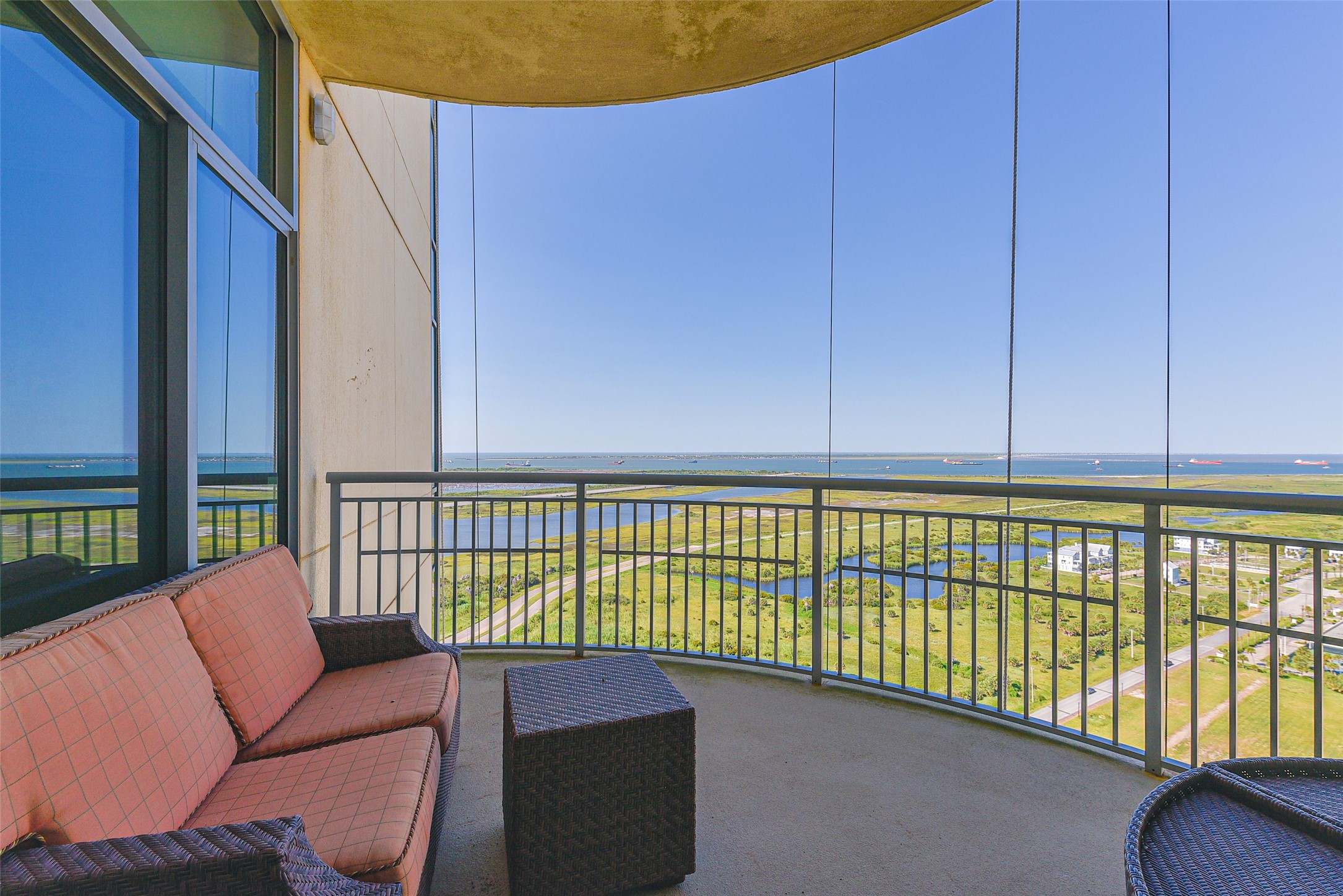 801 East Beach Drive, Unit TW2704 Galveston, TX 77550 - Photo 24 of 48 Views from the North-East balcony. Also pictured is outdoor furniture perfect for enjoying the ocean breeze.