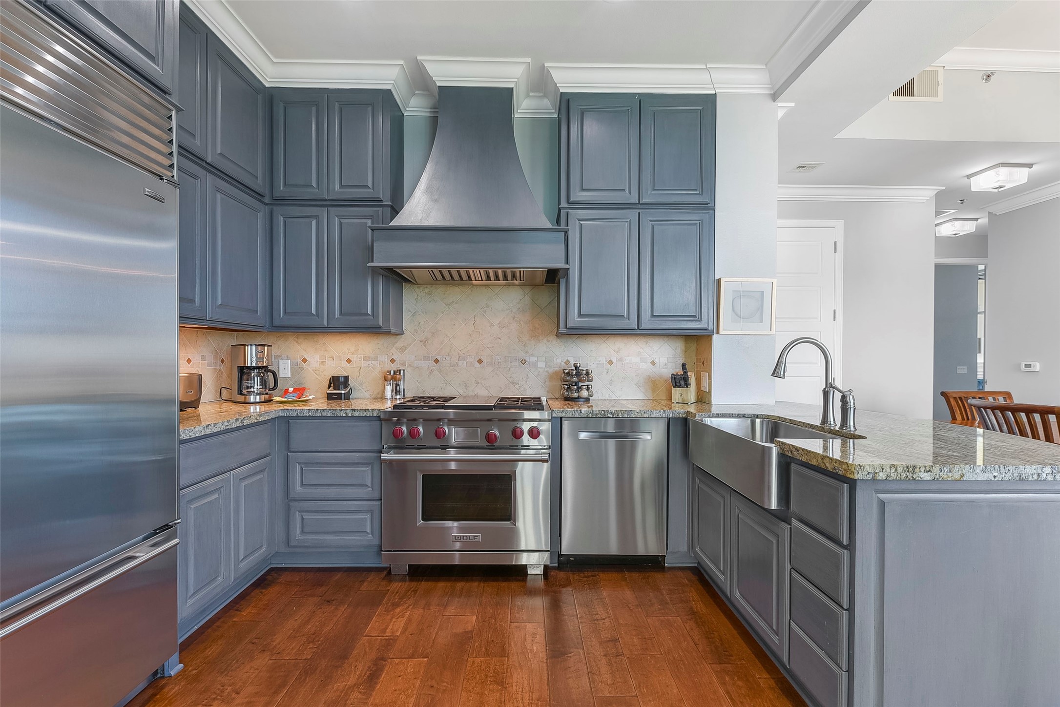 801 East Beach Drive, Unit TW2704 Galveston, TX 77550 - Photo 28 of 48 a kitchen with stainless steel appliances granite countertop a stove a sink dishwasher and a stove
