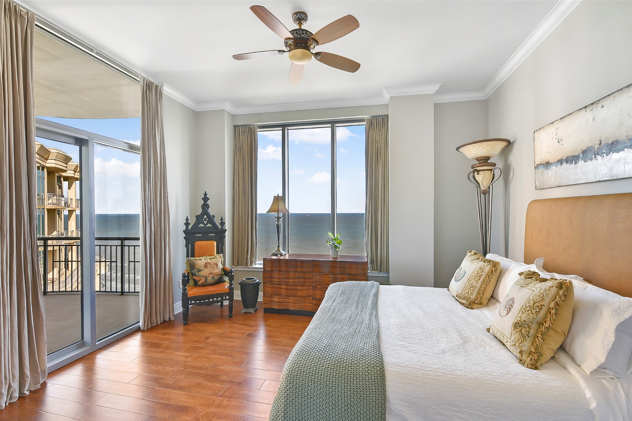 801 East Beach Drive, Unit TW2704 Galveston, TX 77550 - Photo 32 of 48 a bedroom with a bed and glass walk in closet