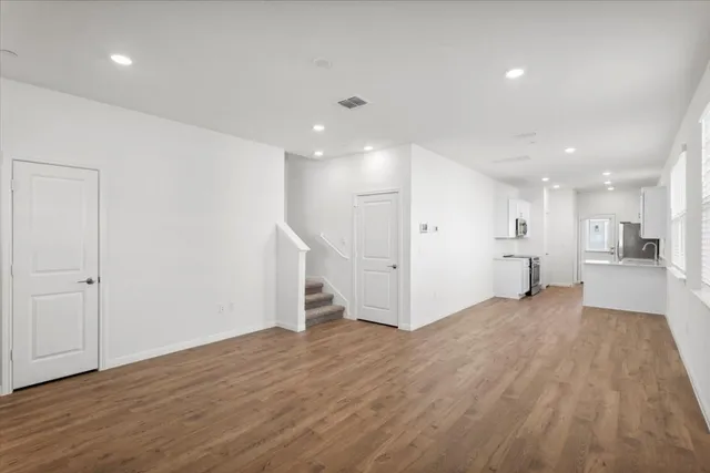 a view of a hallway with washer and dryer