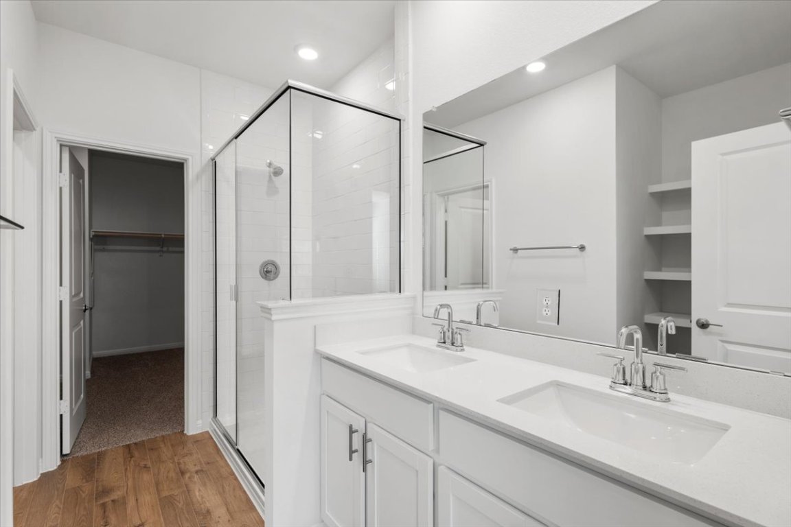 2620 Caleb Asher Loop Round Rock, TX 78665 - Photo 24 of 40 a bathroom with double vanity sink and a mirror