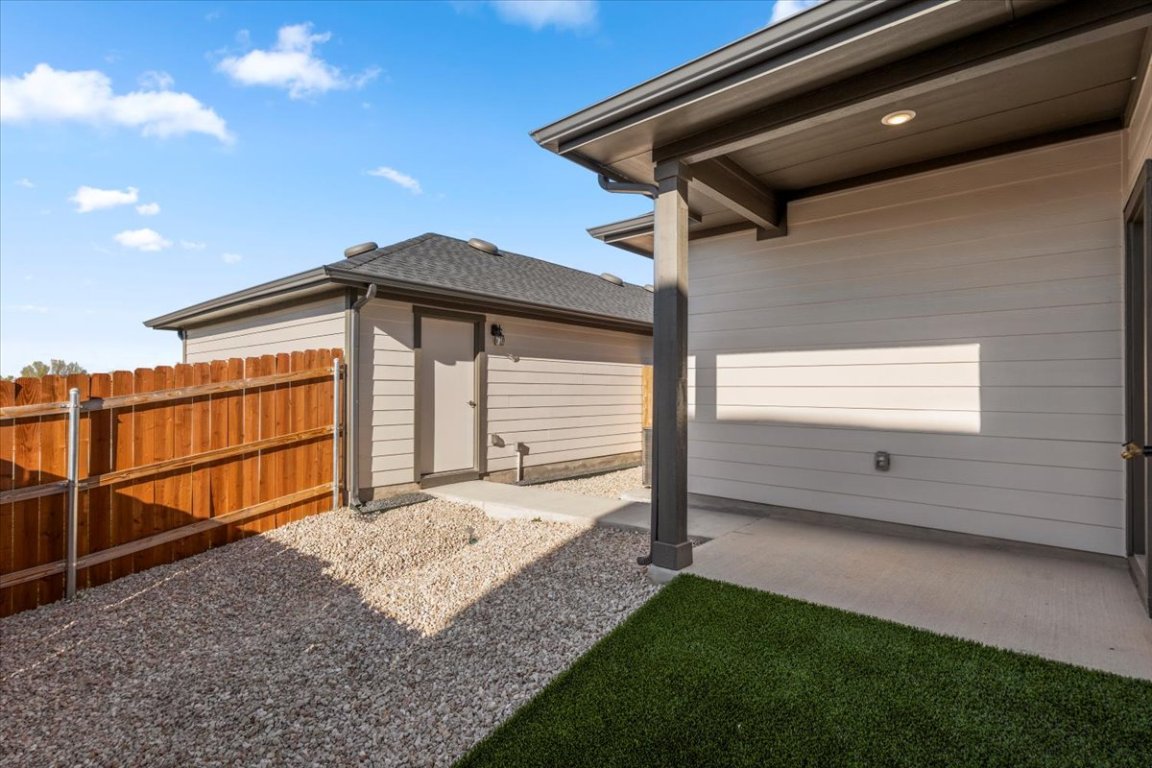 2620 Caleb Asher Loop Round Rock, TX 78665 - Photo 5 of 40 a view of backyard with small cabin and wooden fencing