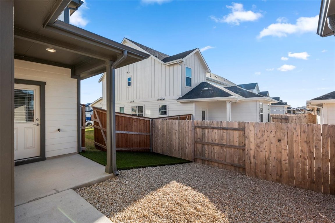 2620 Caleb Asher Loop Round Rock, TX 78665 - Photo 7 of 40 a view of a small house with wooden fence