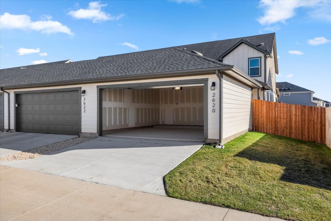 2620 Caleb Asher Loop Round Rock, TX 78665 - Photo 10 of 40 a front view of a house with a yard and garage