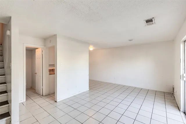 an empty room with white walls