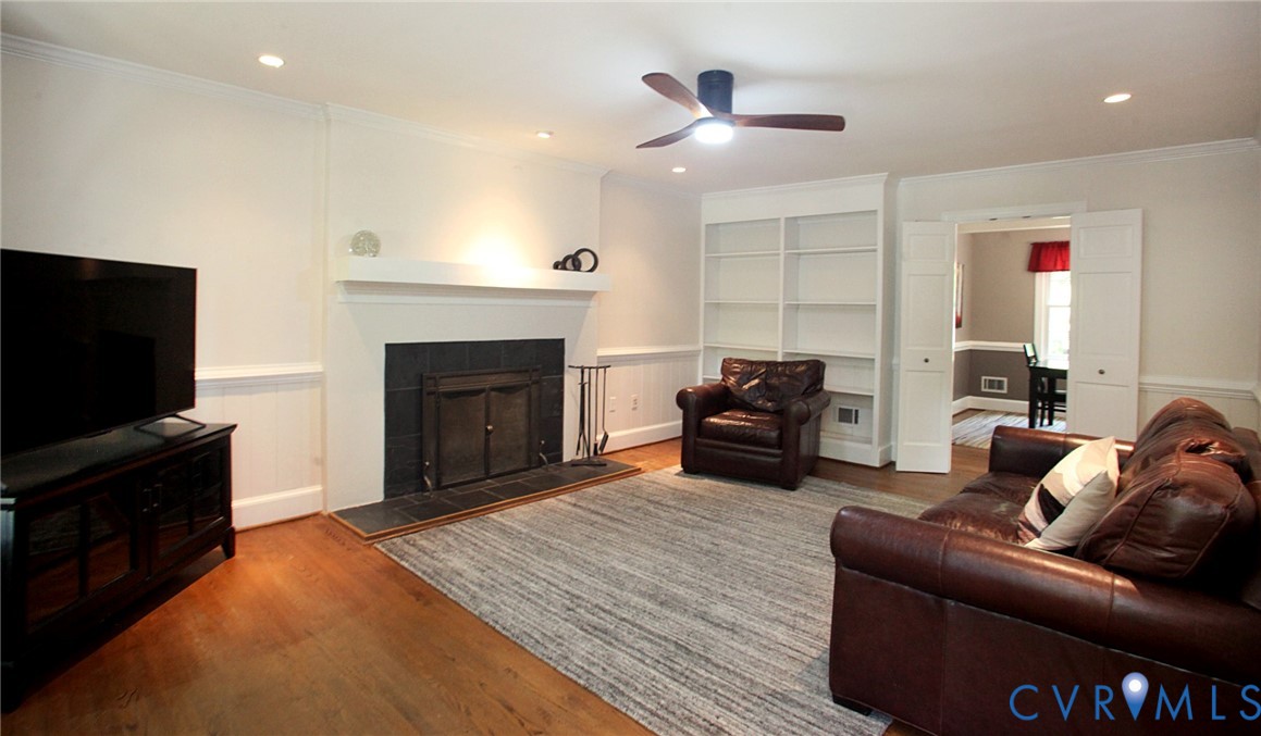 231 Hazelmere Drive Chesterfield, VA 23236 - Photo 13 of 33 a living room with furniture a fireplace and a flat screen tv