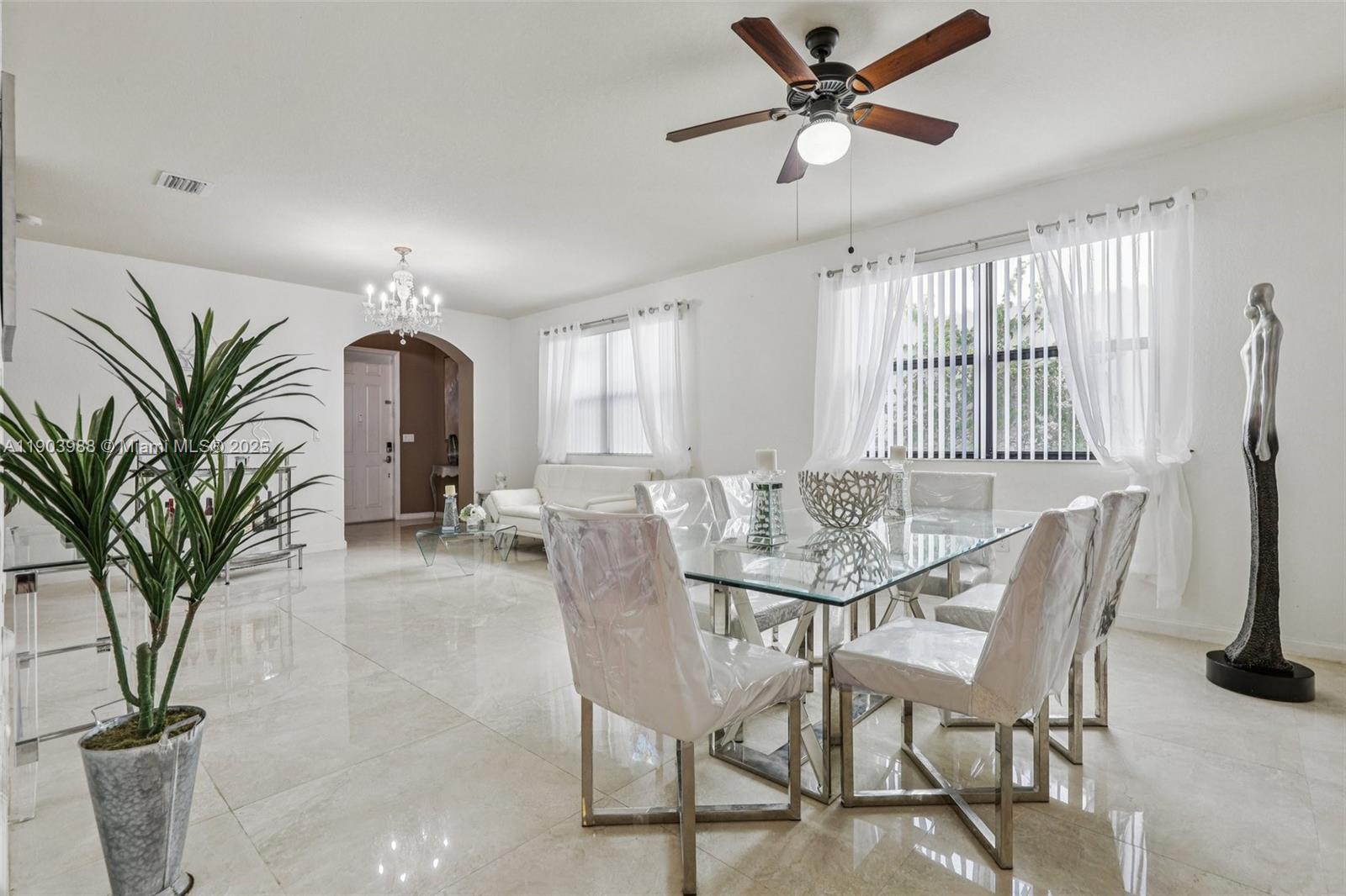22777 Southwest 93rd Court Cutler Bay, FL 33190 - Photo 11 of 54 a view of a livingroom with furniture and a window