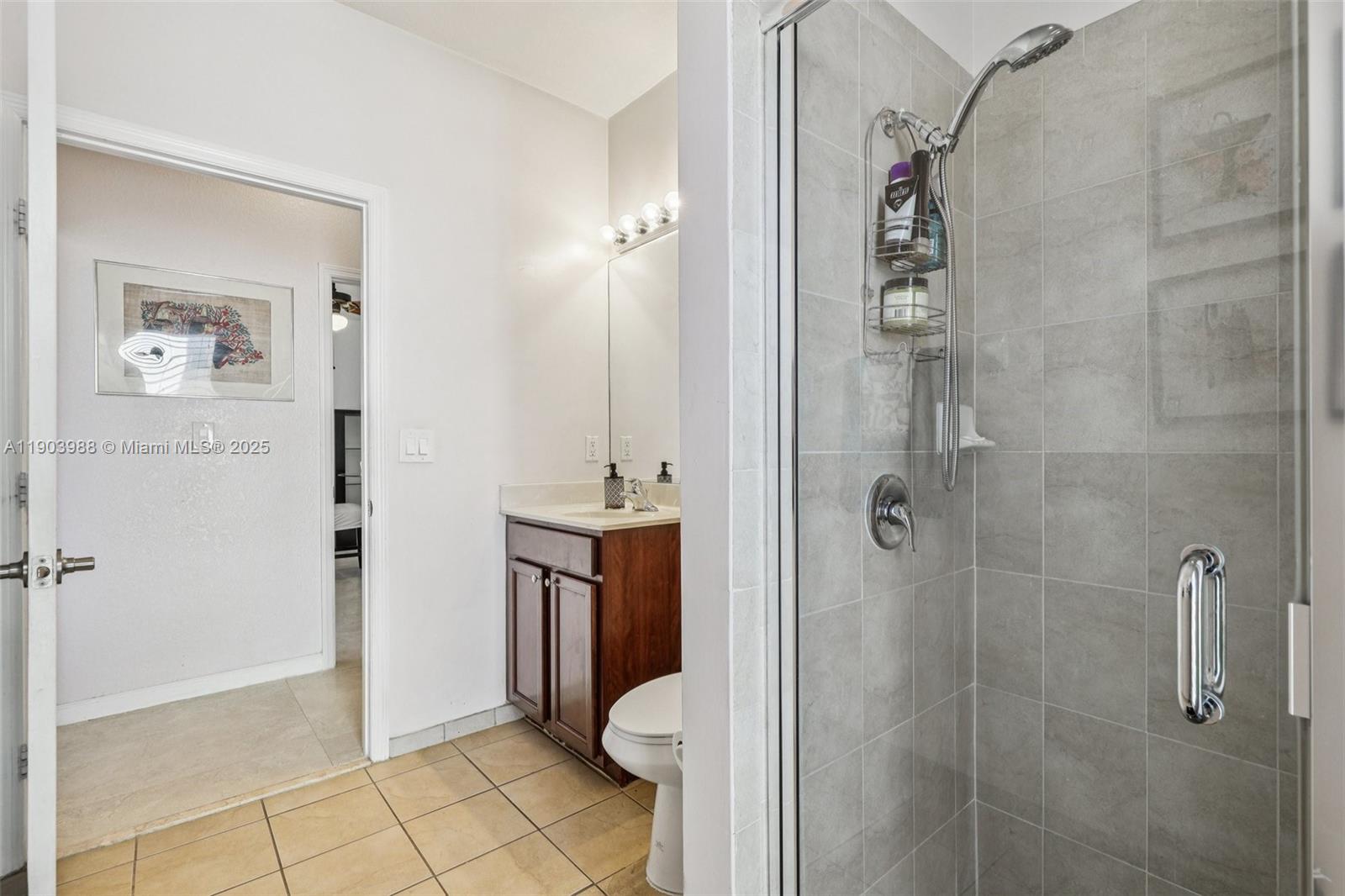 22777 Southwest 93rd Court Cutler Bay, FL 33190 - Photo 19 of 54 a bathroom with a shower and toilet
